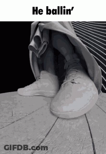 A Black And White Photo Of A Person 'S Feet With The Words He Ballin ' On Top GIF