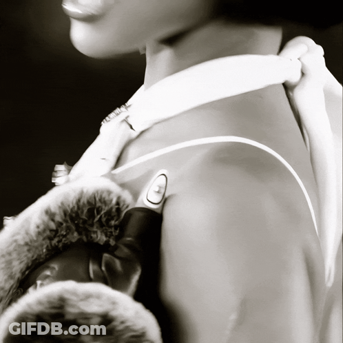 A Black And White Photo Of A Person 'S Shoulder GIF