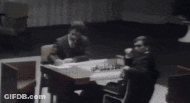 A Black And White Photo Of A Person Standing In A Room With Their Arms Outstretched . GIF