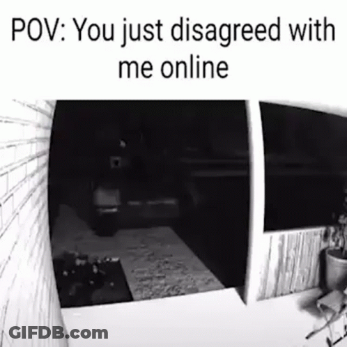 A Black And White Photo Of A Person Standing In Front Of A Door . GIF