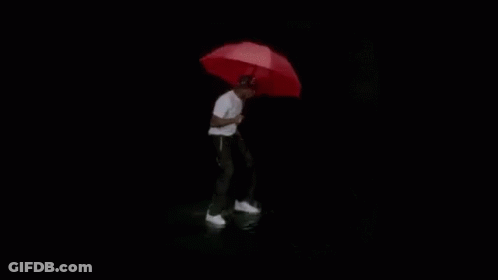 A Black And White Photo Of A Person Standing In The Water . GIF