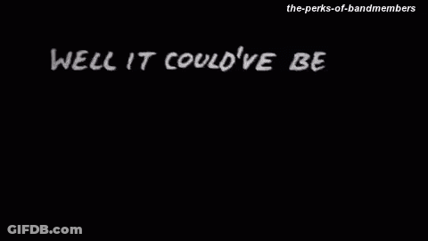 A Black And White Photo Of A Person Walking In The Dark GIF