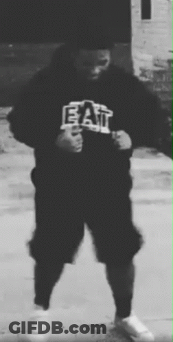 A Black And White Photo Of A Person Wearing A Hoodie That Says Eat . GIF