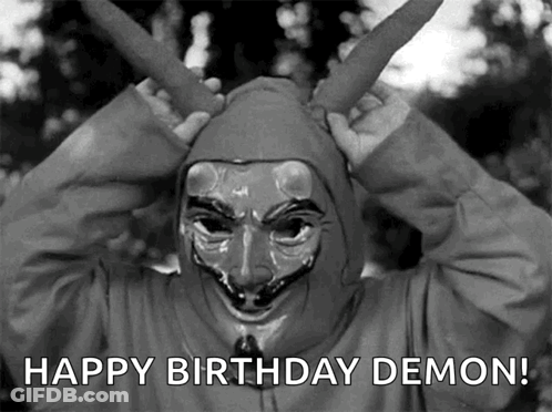 A Black And White Photo Of A Person Wearing A Mask With The Words Happy Birthday Demon Below It GIF