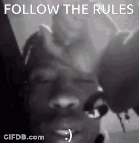 A Black And White Photo Of A Person With A Smiley Face On Their Face . GIF