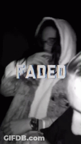 A Black And White Photo Of A Person With Faded Written In White Letters GIF