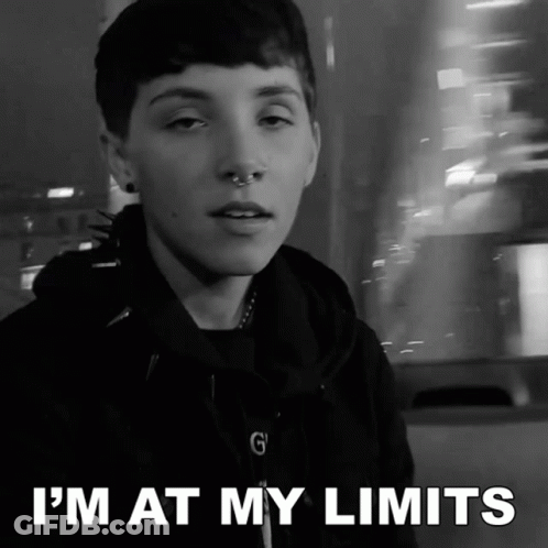 A Black And White Photo Of A Person With The Words " I 'M At My Limits " GIF