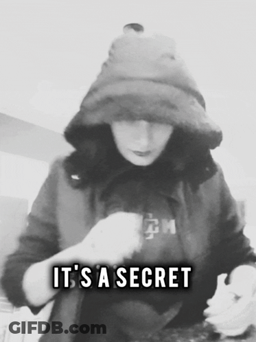 A Black And White Photo Of A Person With The Words " It 'S A Secret " GIF