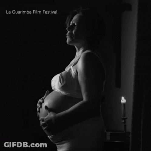 A Black And White Photo Of A Pregnant Woman With La Guarimba Film Festival Written On The Bottom GIF