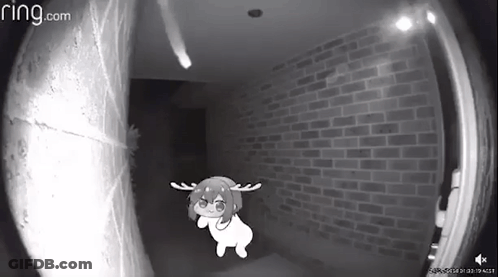 A Black And White Photo Of A Ring Doorbell With A Cartoon Character In The Background . GIF