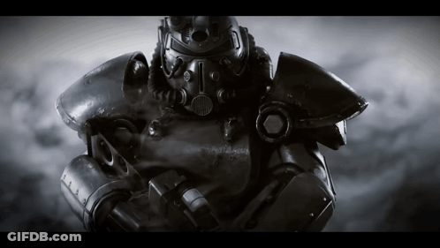A Black And White Photo Of A Robot With A Helmet That Has The Letter T On It GIF