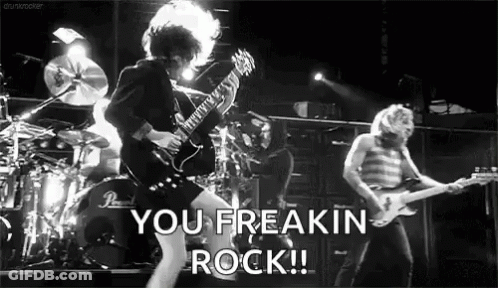 A Black And White Photo Of A Rock Band With The Words You Freakin Rock Written In The Corner GIF