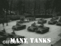 A Black And White Photo Of A Row Of Tanks With The Caption Many Tanks GIF