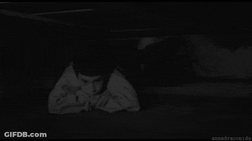 A Black And White Photo Of A Scary Clown With A Huge Mouth GIF
