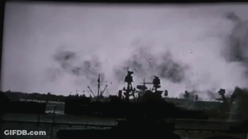 A Black And White Photo Of A Ship In The Water With Smoke Coming Out Of It GIF