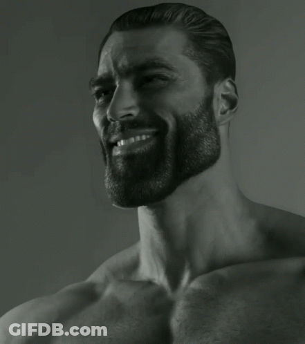 A Black And White Photo Of A Shirtless Man With A Beard Smiling GIF