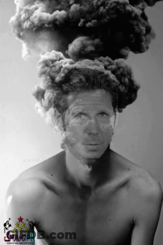 A Black And White Photo Of A Shirtless Man With Smoke Coming From His Head GIF