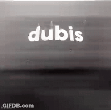 A Black And White Photo Of A Sign That Says Dubis . GIF