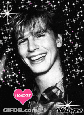 A Black And White Photo Of A Smiling Man With A Heart That Says I Love You GIF