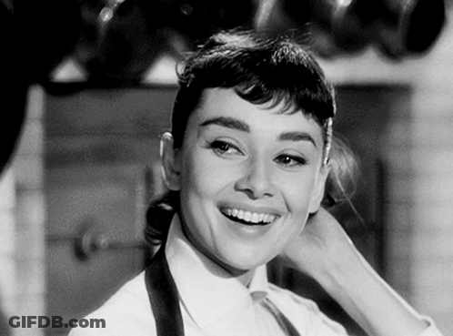 Black And White Photo Of Smiling Young Woman GIF