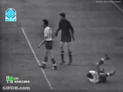 A Black And White Photo Of A Soccer Game From The Year 1950 GIF