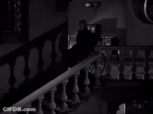 A Black And White Photo Of A Staircase With A Horse Drawn Carriage In The Background . GIF