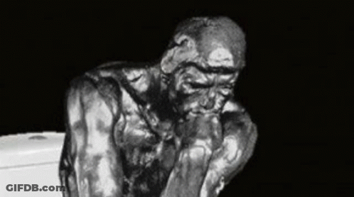 A Black And White Photo Of A Statue Of A Man Sitting On Top Of A Toilet . GIF