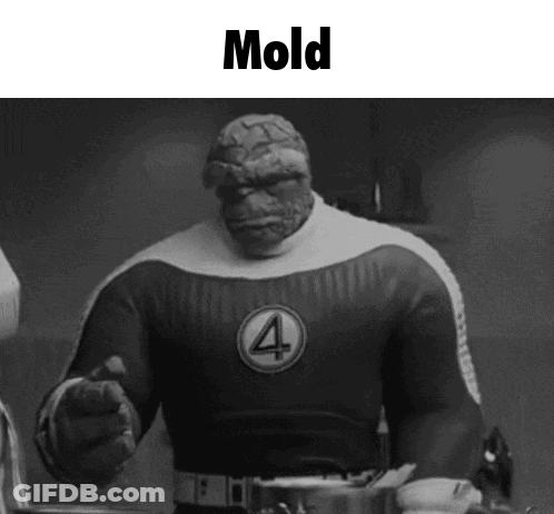 A Black And White Photo Of A Superhero With The Word Mold Written On It . GIF