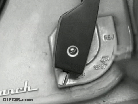 A Black And White Photo Of A Switch That Says " Reu " On It GIF