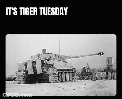A Black And White Photo Of A Tank With The Words It 'S Tiger Tuesday GIF