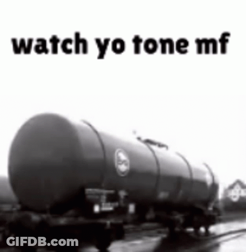 A Black And White Photo Of A Tanker Truck With The Words Watch Yo Tone Mf On The Bottom . GIF