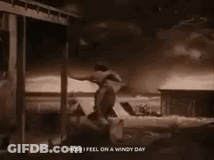 A Black And White Photo Of A Tornado Behind A Wooden Fence With The Words `` How I Feel On A Windy Day '' GIF
