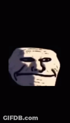 A Black And White Photo Of A Troll Face With A Smile On It . GIF