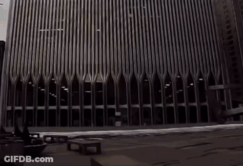 A Black And White Photo Of A Very Tall Building With The Letters Ec On It GIF