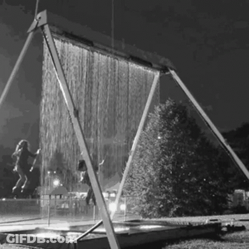 A Black And White Photo Of A Water Curtain GIF
