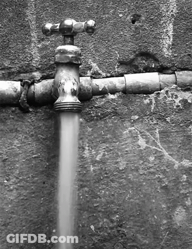 A Black And White Photo Of A Water Faucet With Water Running Out Of It GIF