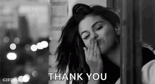 A Black And White Photo Of A Woman Blowing A Kiss With The Words `` Thank You '' . GIF