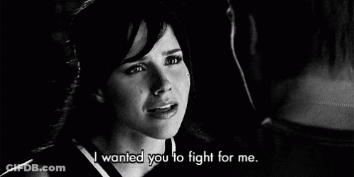 A Black And White Photo Of A Woman Crying Next To A Man . GIF