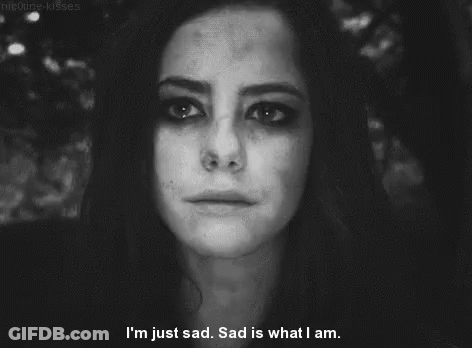 A Black And White Photo Of A Woman Crying With The Words I 'M Just Sad Sad Is What I Am GIF