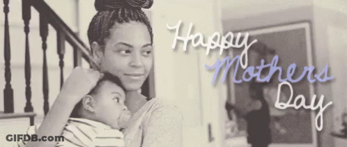 A Black And White Photo Of A Woman Holding A Baby With The Words Happy Mothers Day Written On It GIF