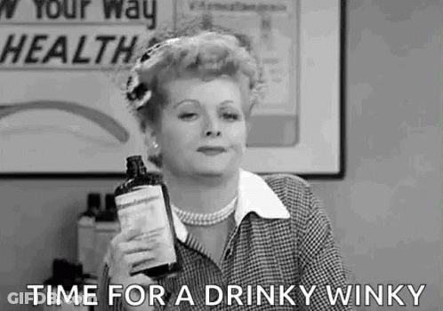 A Black And White Photo Of A Woman Holding A Bottle Of Liquor And Saying `` Time For A Drinky Winky '' . GIF