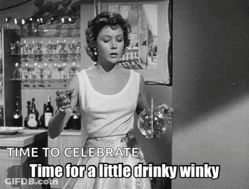 A Black And White Photo Of A Woman Holding A Glass Of Wine And A Pitcher . GIF