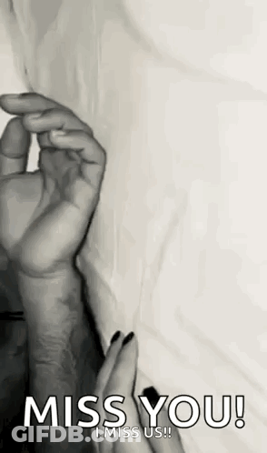A Black And White Photo Of A Woman Holding A Man 'S Hand With The Words `` Miss You ! '' GIF