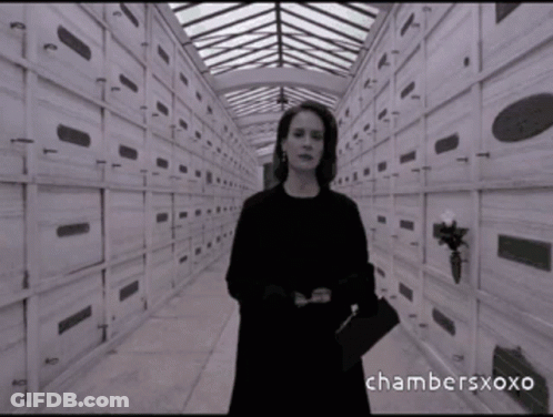 A Black And White Photo Of A Woman In A Cemetery With Chambersxoxo Written On The Bottom Right GIF