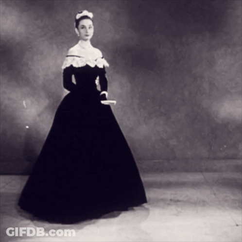 Black And White Photo Of Woman In Long Dress GIF