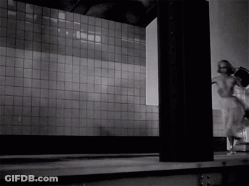 A Black And White Photo Of A Woman In A White Dress Running GIF