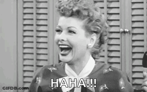 A Black And White Photo Of A Woman Laughing In Front Of A Locker Room . GIF