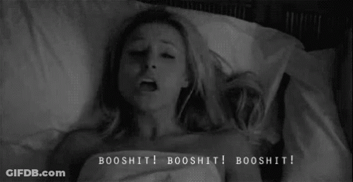 A Black And White Photo Of A Woman Laying In Bed With The Words Booshit Written On The Bottom . GIF
