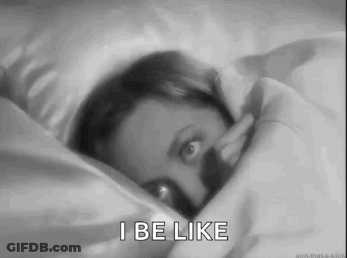 A Black And White Photo Of A Woman Laying In Bed With The Words I Be Like . GIF