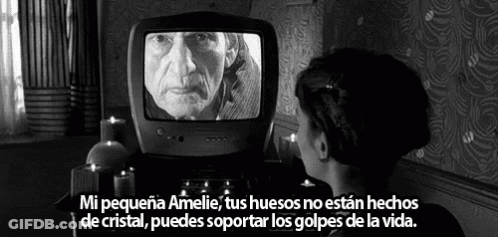 A Black And White Photo Of A Woman Looking At An Old Man On A TV GIF